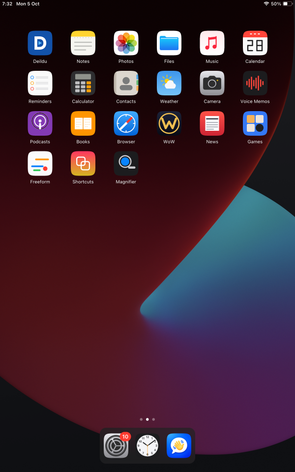 The SpringBoard home screen on the tablet: six columns of app icons over a dark red and blue wallpaper, with a dock at the bottom.